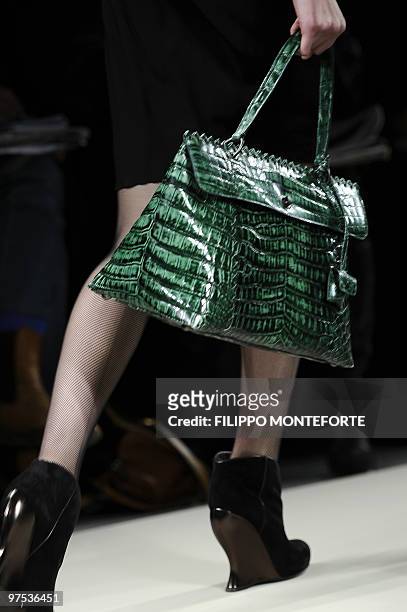 Model displays a creation as part of Bottega Veneta Fall-Winter 2010-2011 ready-to-wear collection on February 27, 2010 during the Women's fashion...