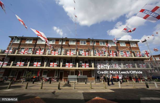 Residents decorate their properties within the Kirby Estate in Bermondsey with St George flags and bunting of show support for England at the FIFA...