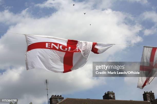 Residents decorate their properties within the Kirby Estate in Bermondsey with St George flags and bunting of show support for England at the FIFA...