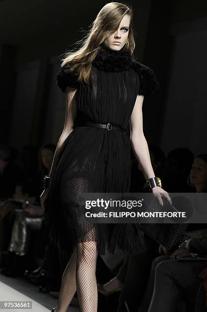 Model displays a creation as part of Bottega Veneta Fall-Winter 2010-2011 ready-to-wear collection on February 27, 2010 during the Women's fashion...