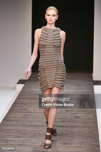 Model walks the runway during the Guy Laroche Ready to Wear show as part of the Paris Womenswear Fashion Week Fall/Winter 2011 at Le Carrousel du...