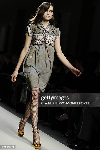 Model displays a creation as part of Bottega Veneta Fall-Winter 2010-2011 ready-to-wear collection on February 27, 2010 during the Women's fashion...