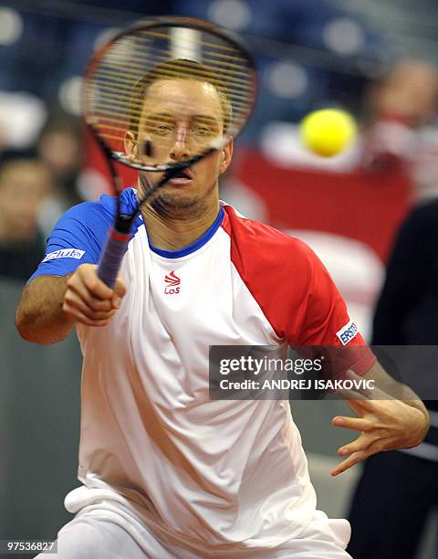 Serbia's Viktor Troicki returns the ball to Sam Querrey of the US during their Davis Cup World Group first round tennis match on March 7 in Belgrade...