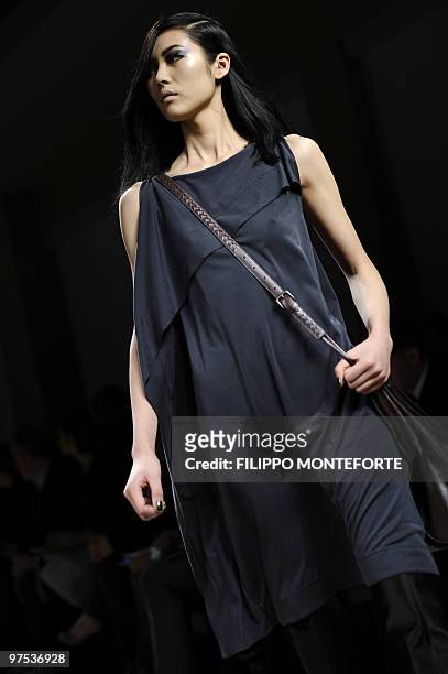 Model displays a creation as part of Bottega Veneta Fall-Winter 2010-2011 ready-to-wear collection on February 27, 2010 during the Women's fashion...