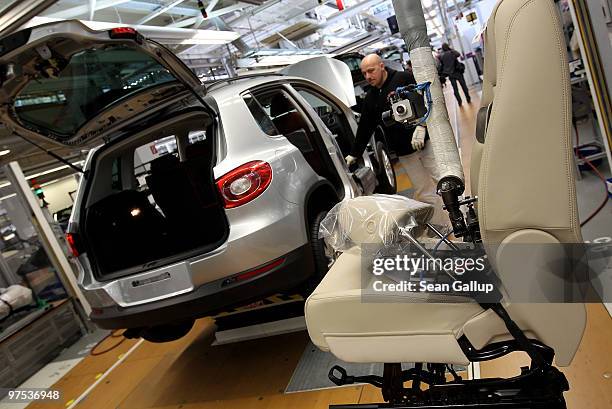 Workers assemble Volkswagen Golf and Tiguan cars on the assembly line at the VW factory on March 8, 2010 in Wolfsburg, Germany. Volkswagen will...