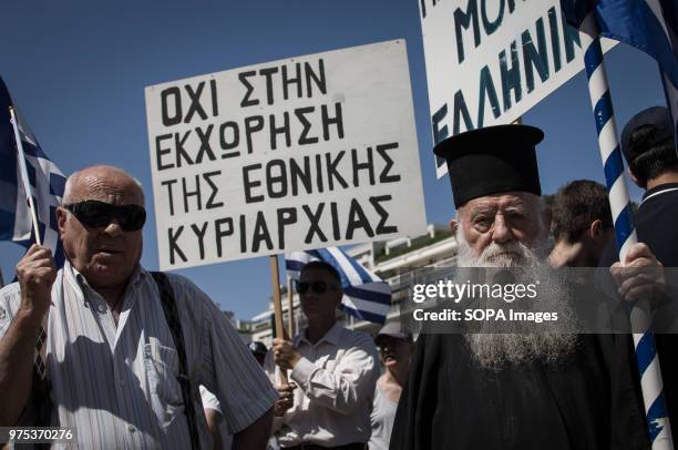 People seen holding placard and Greek flags at the demonstration. People demonstrated in Syntagma square, Athens, in protest at the Greek...