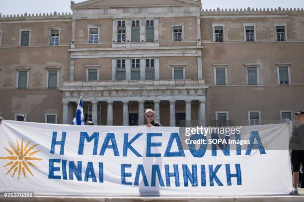 Demonstrators seen holding a banner at the demonstration. People demonstrated in Syntagma square, Athens, in protest at the Greek government's...