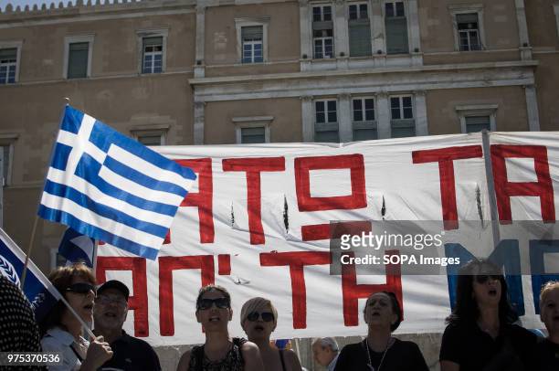 Demonstrators seen holding a banner at the demonstration. People demonstrated in Syntagma square, Athens, in protest at the Greek government's...