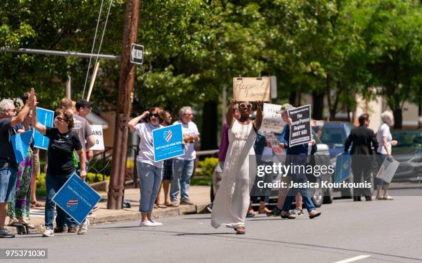 Protesters demonstrate before U.S. Attorney General Jeff Sessions delivers remarks on immigration and law enforcement actions at Lackawanna College...