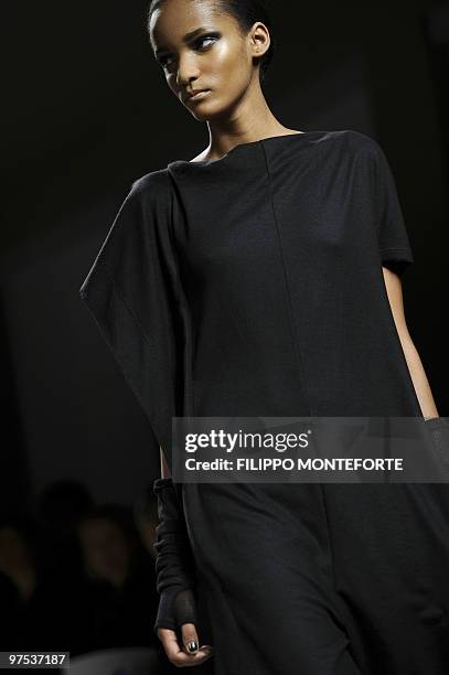 Model displays a creation as part of Bottega Veneta Fall-Winter 2010-2011 ready-to-wear collection on February 27, 2010 during the Women's fashion...