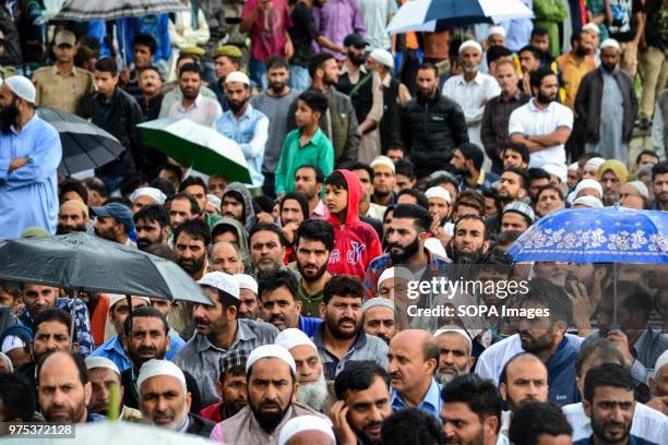 People gather to perform funeral prayers for Shujaat Bukhari, veteran journalist and Editor-in-Chief of English daily 'Rising Kashmir,' in Kreeri,...