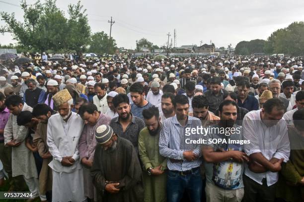 Kashmiri residents offer funeral prayers for Shujaat Bukhari, veteran journalist and Editor-in-Chief of English daily 'Rising Kashmir,' in Kreeri,...