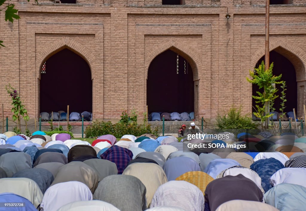 Kashmiri Muslims pray outside the Jamia Masjid or grand...