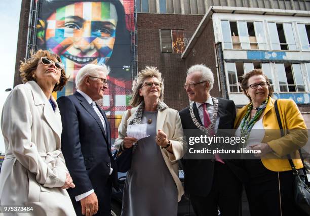 May 2018, Netherlands, Amsterdam: German President Frank-Walter Steinmeier and his wife Elke Bueedenbender viewing the former NDSM-wharf with borough...