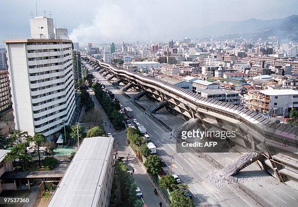 An overview of Nishinomiya shows a collapsed elevated highway 17 January 1995, as a powerful earthquake measuring 7, 2 on the Richter scale rocked...