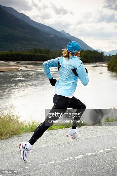 woman running - john p kelly stock pictures, royalty-free photos & images