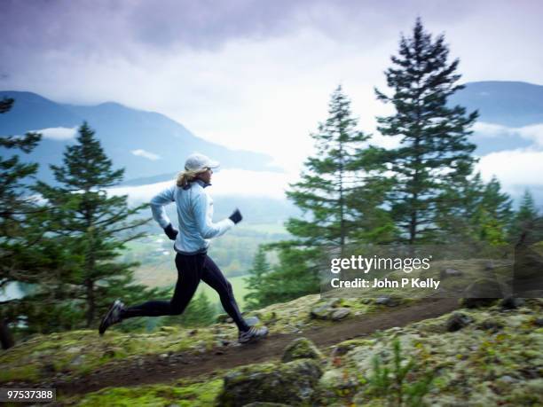 woman running - john p kelly stock pictures, royalty-free photos & images