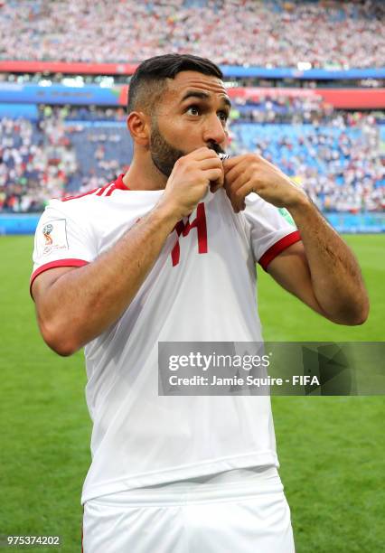 Saman Ghoddos of Iran kisses his badge in celebration following his sides victory in the 2018 FIFA World Cup Russia group B match between Morocco and...