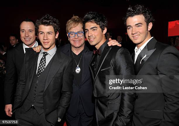 David Furnish, musician Nick Jonas, musician sir Elton John, musician Joe Jonas and musician Kevin Jonas attend the 18th Annual Elton John AIDS...