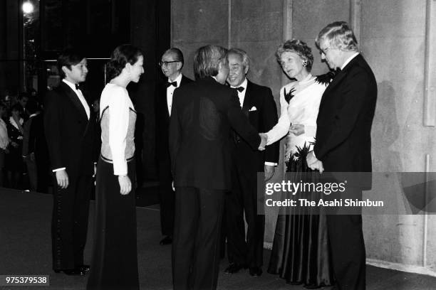 Crown Prince Akihito, Crown Princess Michiko and Prince Naruhito greet on arrival at the NHK Hall to attend the New York Metropolitan Opera...