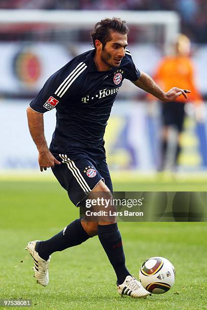 Hamit Altintop of Muenchen runs with the ball during the Bundesliga match between 1. FC Koeln and FC Bayern Muenchen at RheinEnergieStadion on March...