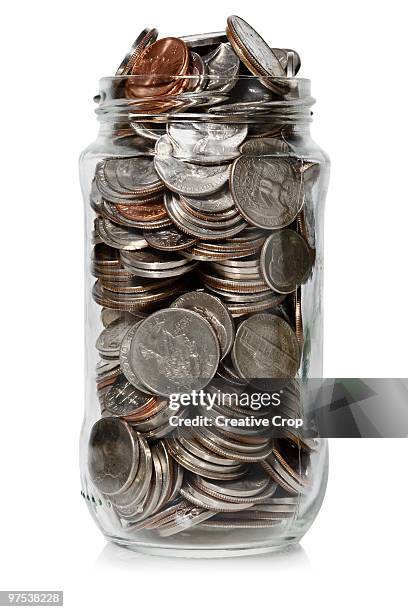 jam jar filled with united states coins - creative rf stock-fotos und bilder