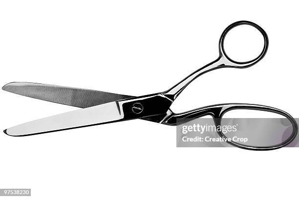 a pair of open chrome scissors - creative rf stock-fotos und bilder