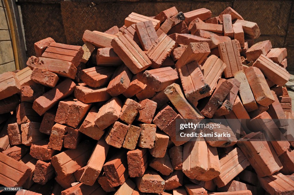 Pile of red bricks in construction site