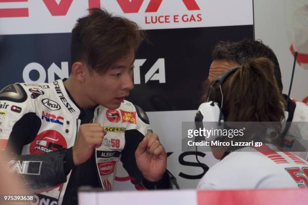 Tatsuki Suzuki of Japan and Sic 58 Squadra Corse speaks in box with mechanics after crashed out during the MotoGp of Catalunya - Free Practice at...