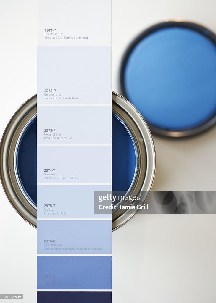 Blue paint swatch over corresponding paint can