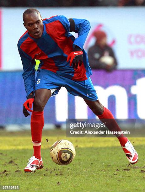 Fritzon Baptiste of Haiti runs with the ball during the charity match for earthquake victims in Haiti between ran Allstar team and National team of...