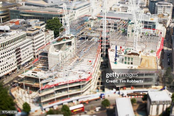 office building under construction from above - tilt shift stock pictures, royalty-free photos & images