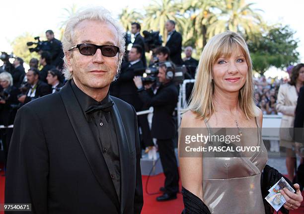 Canadian composer and producer Luc Plamondon and a guest arrive at the Festival Palace to attend the premiere of US director Sofia Coppola's film...