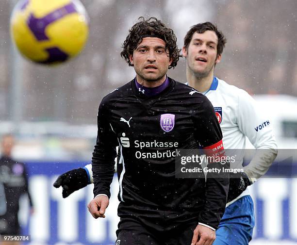 Patrick Mayer of Heidenheim battles for the ball with Angelo Barletta of Osnabrueck during the 3. Liga match between 1. FC Heidenheim andVfL...