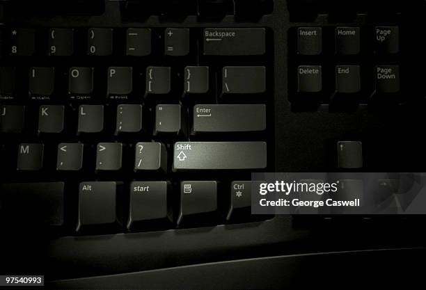 keyboard with an emphasis on the shift key - shift key stock pictures, royalty-free photos & images