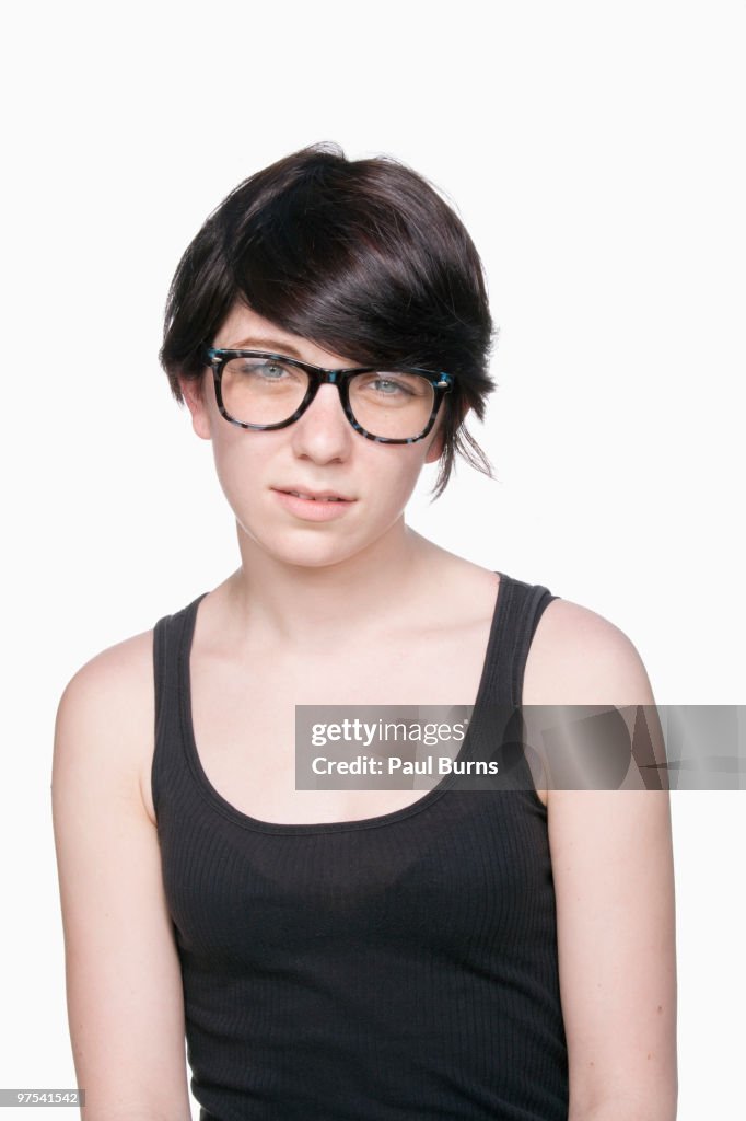 Girl with glasses looking at camera