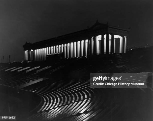 Night view of the Chicago's football stadium, Soldier Field, with its columns illuminated, 1953.