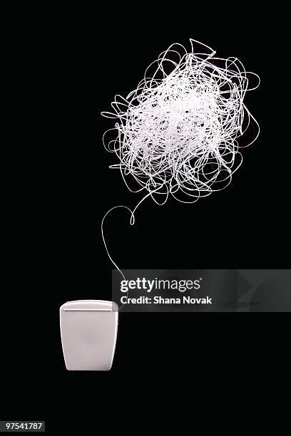 tooth floss in the shape of an idea bubble - shana novak stock pictures, royalty-free photos & images