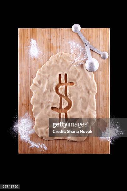 dollar sign cut-out of dough - shana novak stock pictures, royalty-free photos & images