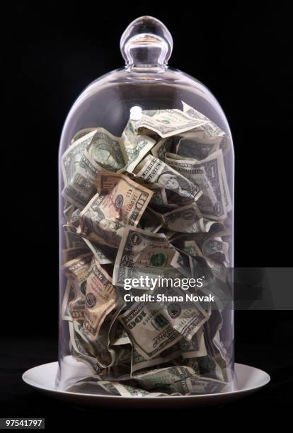 paper bills under glass - shana novak stock pictures, royalty-free photos & images