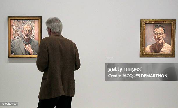 Person looks at "Self-portrait, reflection" and "Reflection " , two paintings of Britain's Lucian Freud, grandson of Sigmund Freud, at the Georges...