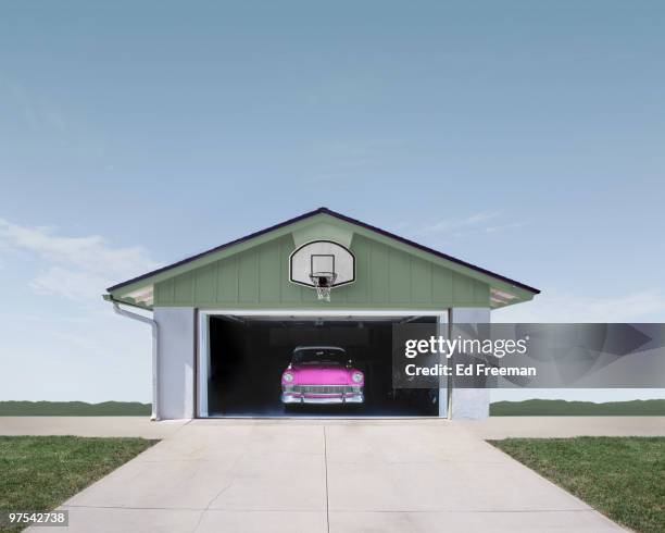 classic car in suburban garage - garage doors stock pictures, royalty-free photos & images