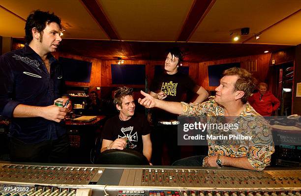 Andy Strachan, Scott Owen, Chris Cheney of The Living End with Jimmy Barnes in a recording studio control room on 17th September 2004 in Melbourne,...