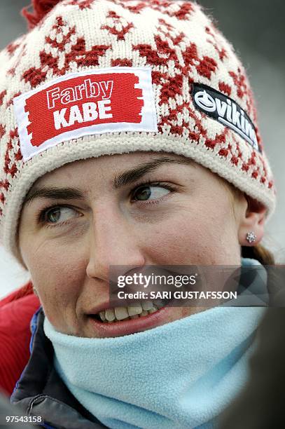 Second-placed Justyna Kowalczyk of Poland smiles after the ladies' cross country pursuit at the FIS World Cup Lahti Ski Games, in Lahti, Finland, on...