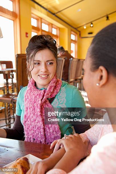 two women sitting together in coffee shop  - manchester vermont foto e immagini stock