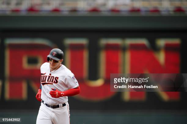 Logan Morrison of the Minnesota Twins rounds the bases after hitting a home run against the Los Angeles Angels of Anaheim during the game on June 10,...
