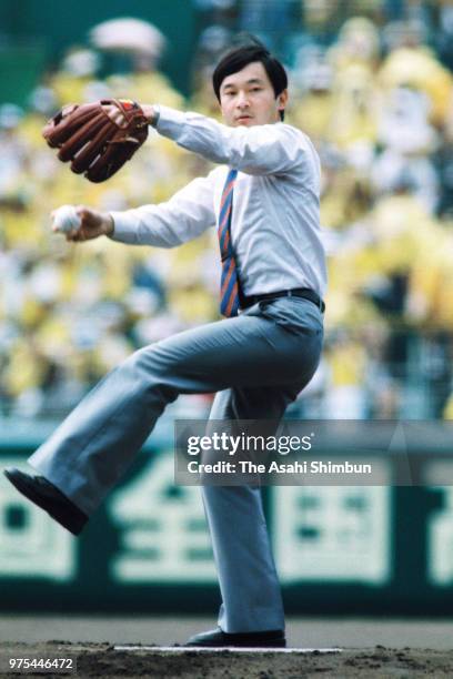 Prince Naruhito throws a ceremonial first pitch during the opening ceremony of the 70th All Japan High School Baseball Tournament at Hanshin Koshien...