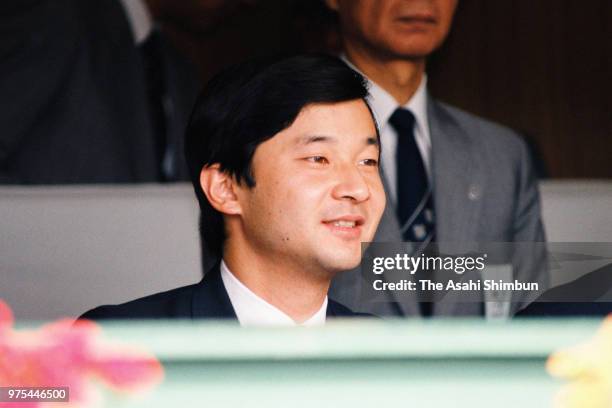 Prince Naruhito attends the opening ceremony of the 70th All Japan High School Baseball Tournament at Hanshin Koshien Stadium on August 8, 1988 in...