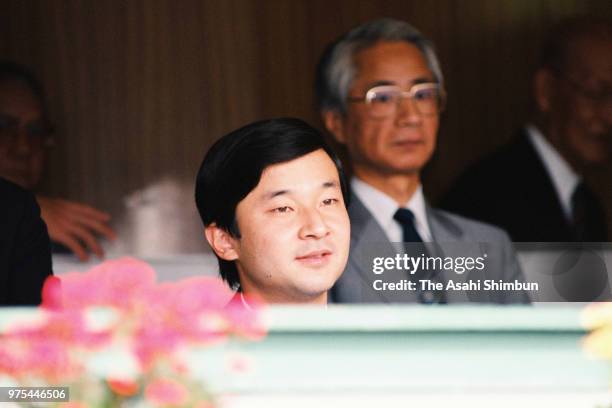 Prince Naruhito attends the opening ceremony of the 70th All Japan High School Baseball Tournament at Hanshin Koshien Stadium on August 8, 1988 in...