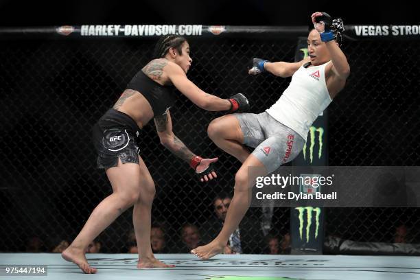 Claudia Gadelha of Brazil lands a punch against Carla Esparza in the second round in their strawweight bout during the UFC 225: Whittaker v Romero 2...